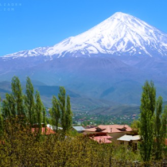 Mount Damavand in the Alborz Mountain range, North of Tehran, Iran. Shot in May 2015. This is a composition of two shots, one from Mount Damavand and one from a village nearby.